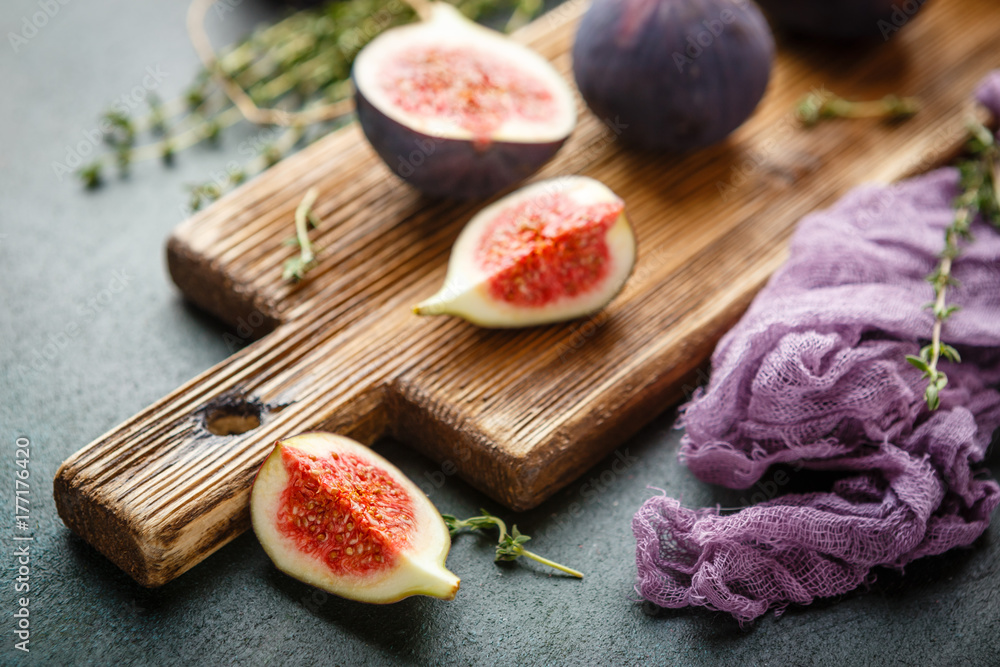 Juicy fig fruits on a dark background