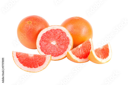 Collection of whole pink grapefruit and slices isolated on white background