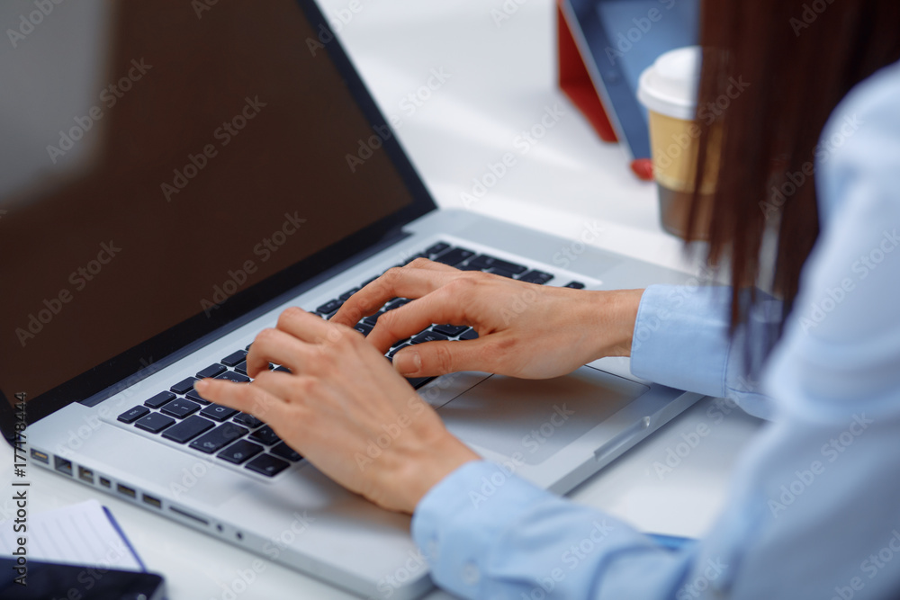 Close up of laptop and hands typing Close up of laptop and hands typing