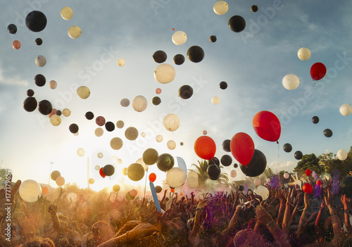 Big festival outdoors with music and balloons photo