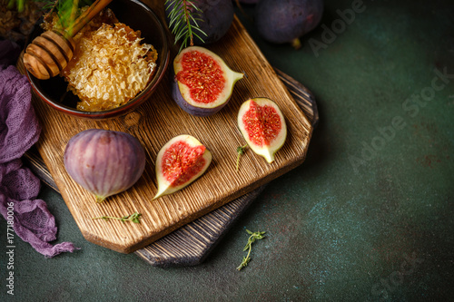 Juicy fig fruits on a dark background