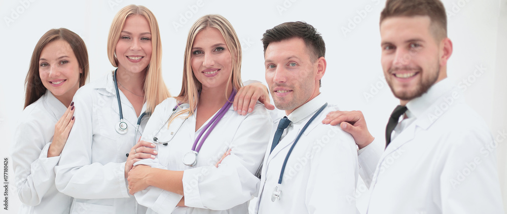 Team of medical professionals looking at camera, smiling. Team of medical professionals looking at camera, smiling.