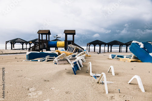 Deserted Playground and Chairs at Winter Beach