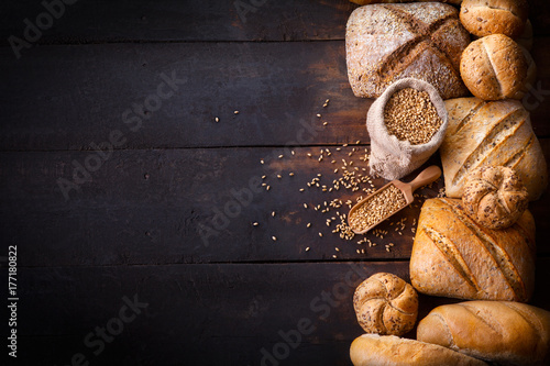 Bread on wooden table, top view.