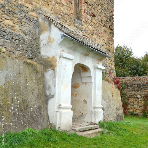 Fortified medieval saxon church in the village Barcut, Bekokten, Brekolten,Transylvania,Romania photo