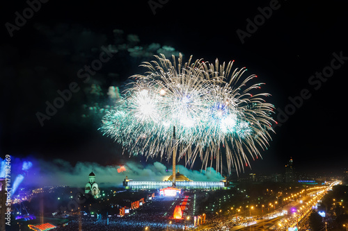 Bright fireworks explosions in night sky