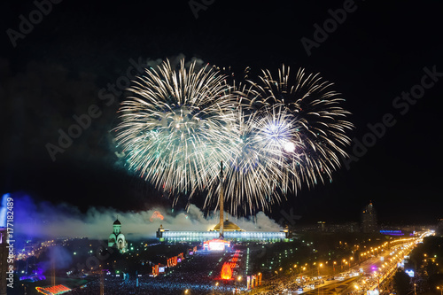 Bright fireworks explosions in night sky