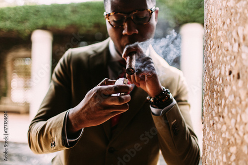 A gentleman taking a cigar break