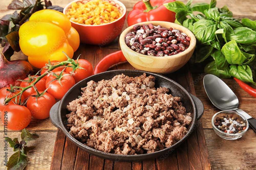 Cooked minced meat and vegetables on kitchen table Cooked minced meat and vegetables on kitchen table