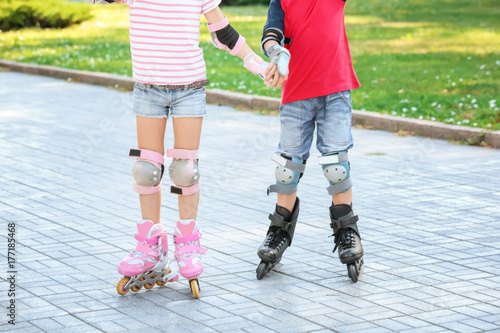 Active children rollerskating in park