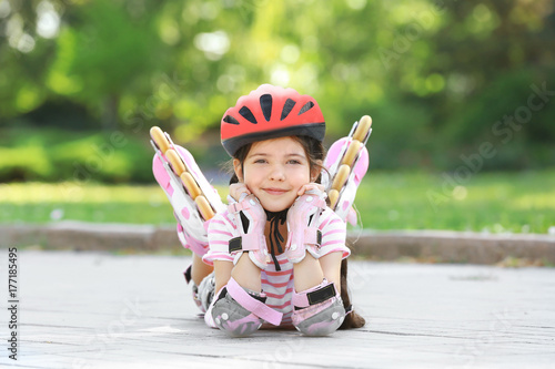 Cute girl on roller skates ...