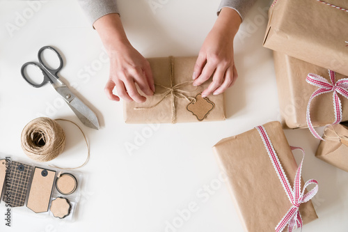 Woman wrapping Christmas gifts.