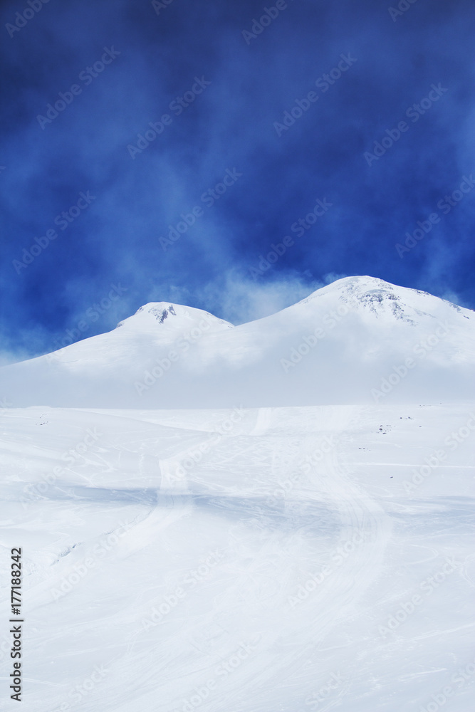 Two snow-capped peaks of Mount Elbrus