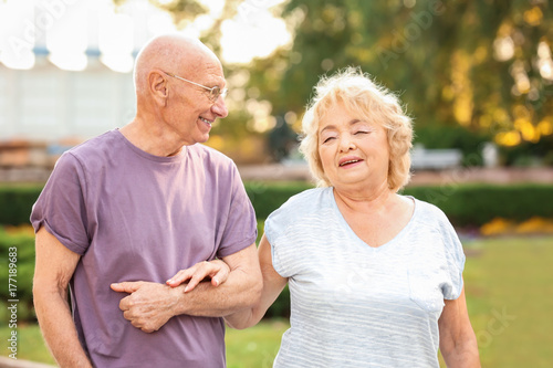 Cute elderly couple walking...