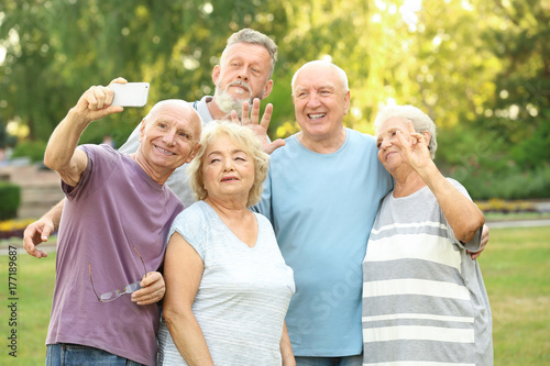 Group of elderly people tak...