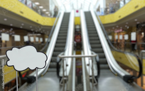 Defocused image of the escalator in the shopping center. Place for your text or logo.