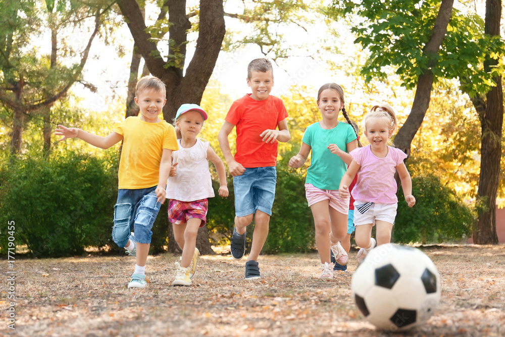 Cute children playing with ball in park Cute children playing with ball in park