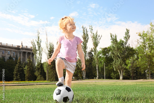 Cute girl with soccer ball ...