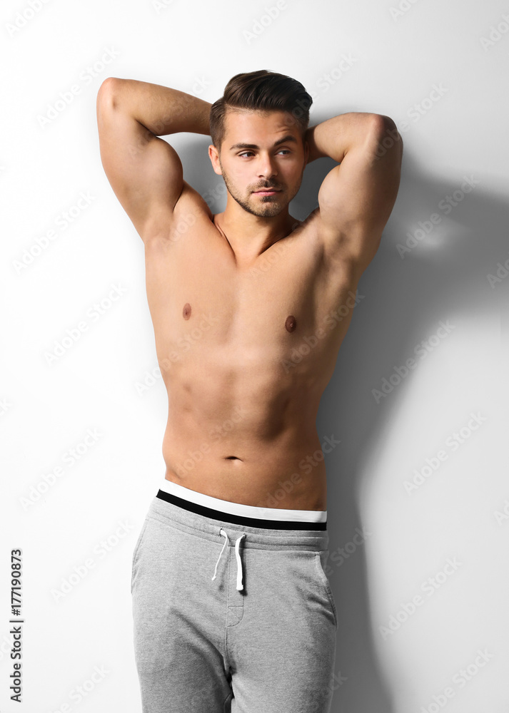 Fototapeta premium Sexy shirtless man on white background