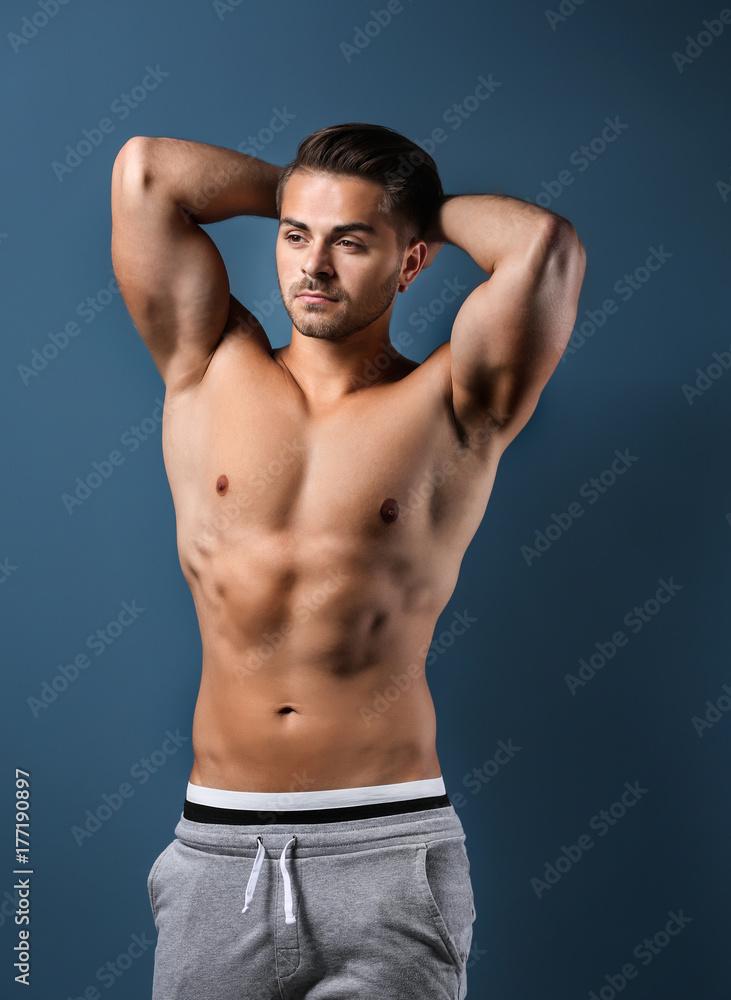 Sexy shirtless man on color background