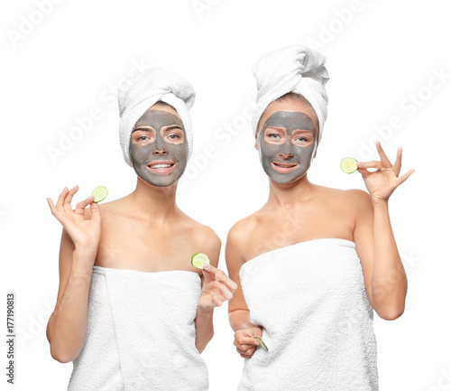 Young women with facial mas...