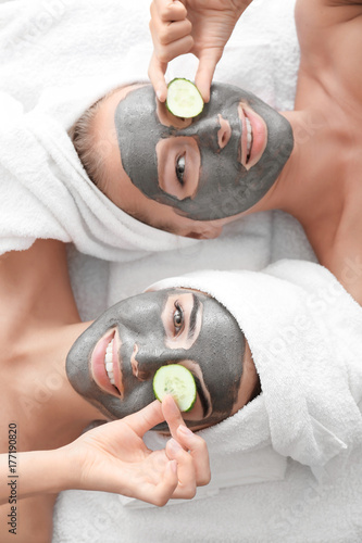 Young women with facial mas...