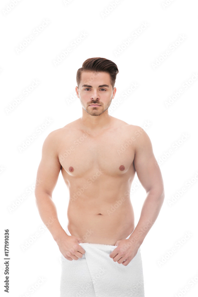 Sexy man wrapped in towel on white background