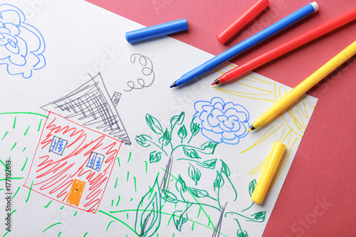 Child's drawing of house and trees on color background, closeup