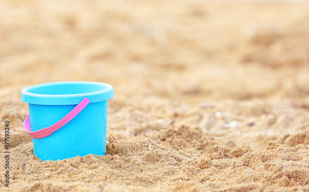 Children's beach bucket on sand Children's beach bucket on sand