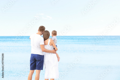 Happy couple with little so...