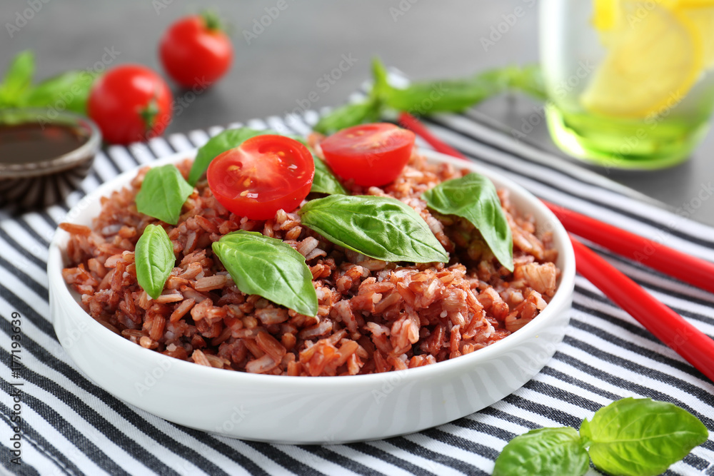 Plate with brown rice on table Plate with brown rice on table