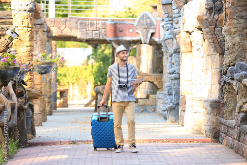 Handsome young tourist with...