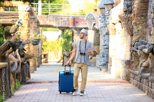 Handsome young tourist with...
