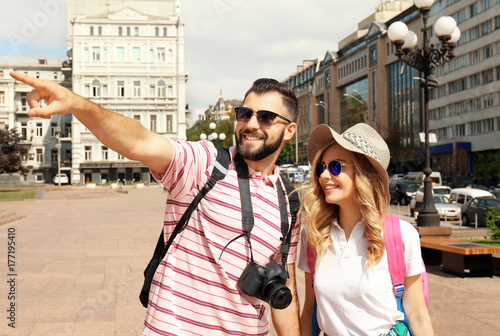 Happy young tourists walkin...