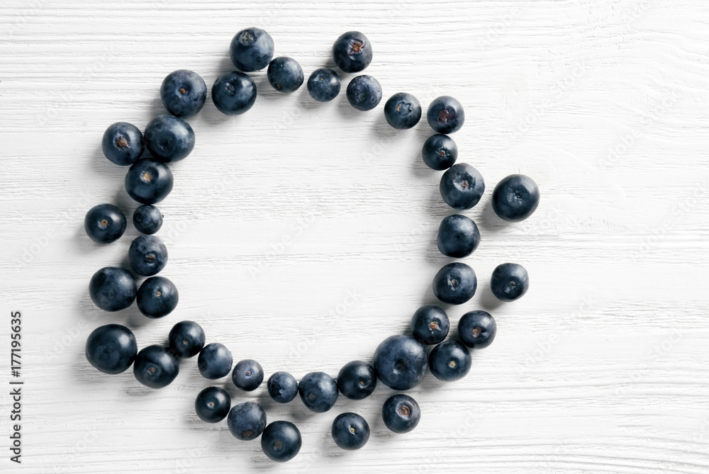 Fresh acai berries on wooden background Fresh acai berries on wooden background
