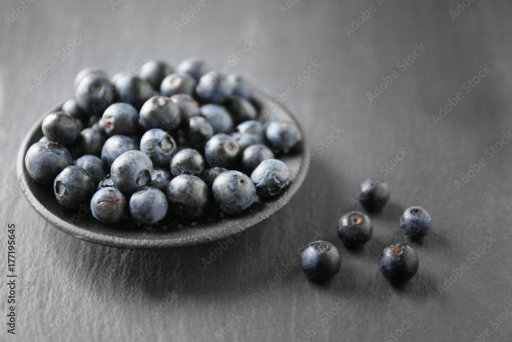 Plate with fresh acai berries on table, closeup Plate with fresh acai berries on table, closeup