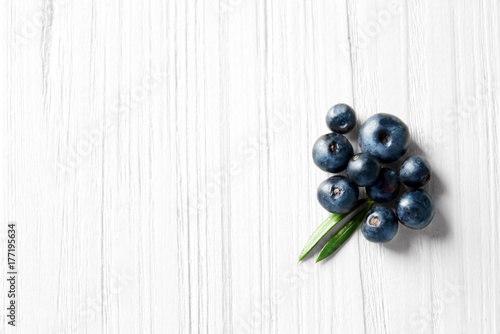 Fresh acai berries on wooden background