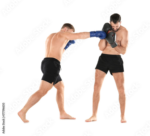 Male boxers fighting on white background