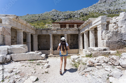 Woman traveller exploring ancient ruins