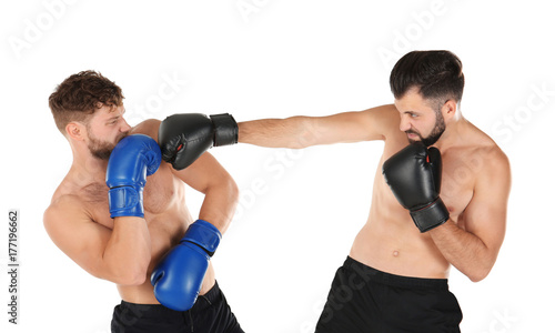 Male boxers fighting on white background