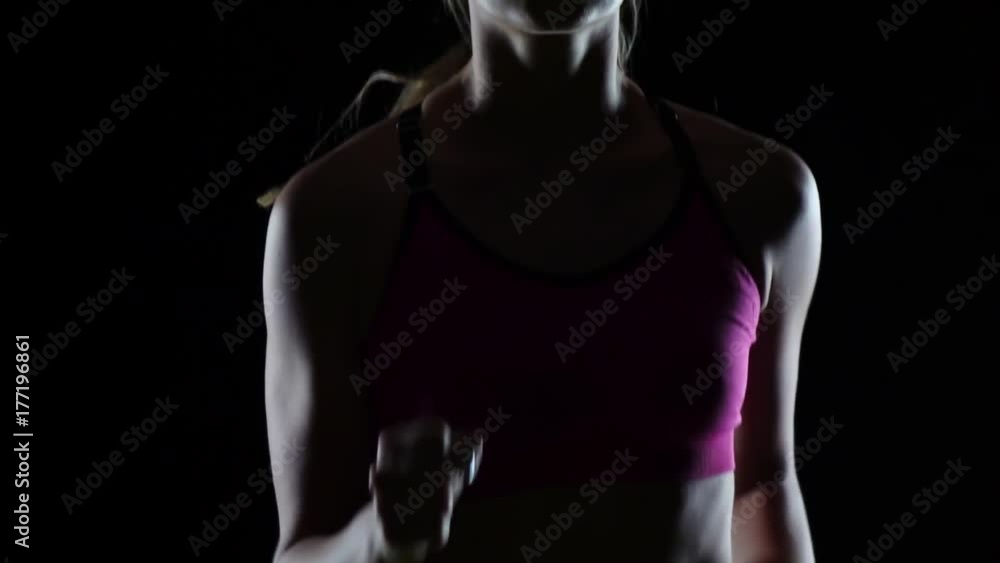 Sports running athlete on a black screen. Slow motion. Close up Sports running athlete on a black screen. Slow motion. Close up