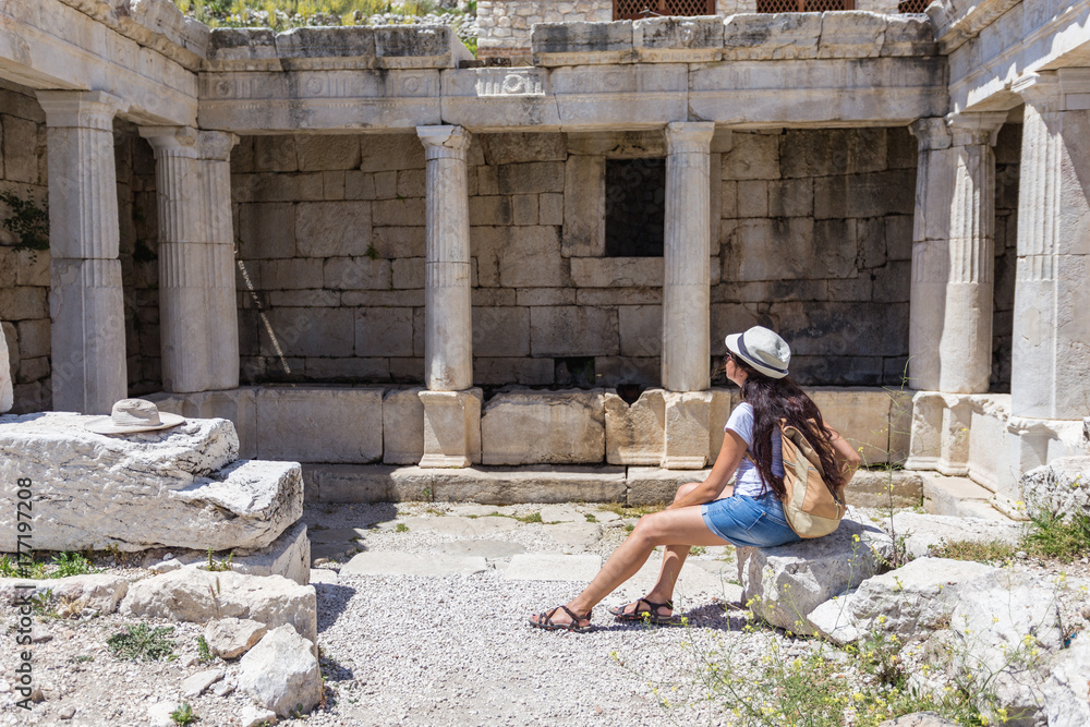 Woman traveller exploring ancient ruins