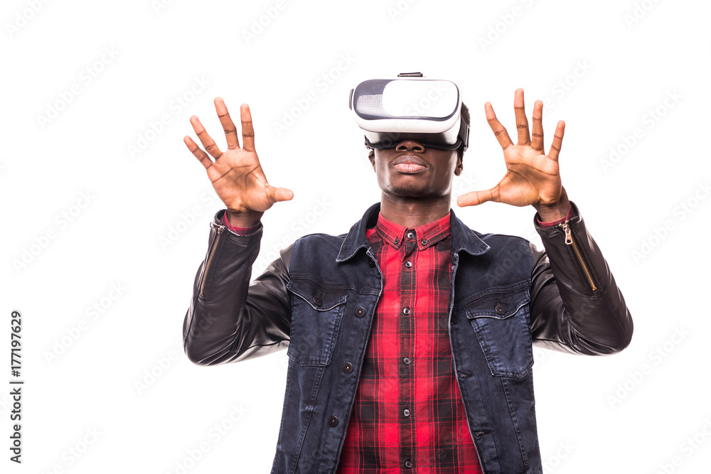 Technology, gaming, entertainment and people concept. African man wearing formal suit and virtual reality headset or 3d glasses, playing video game, gesturing with his hands and catching something Technology, gaming, entertainment and people concept. African man wearing formal suit and virtual reality headset or 3d glasses, playing video game, gesturing with his hands and catching something