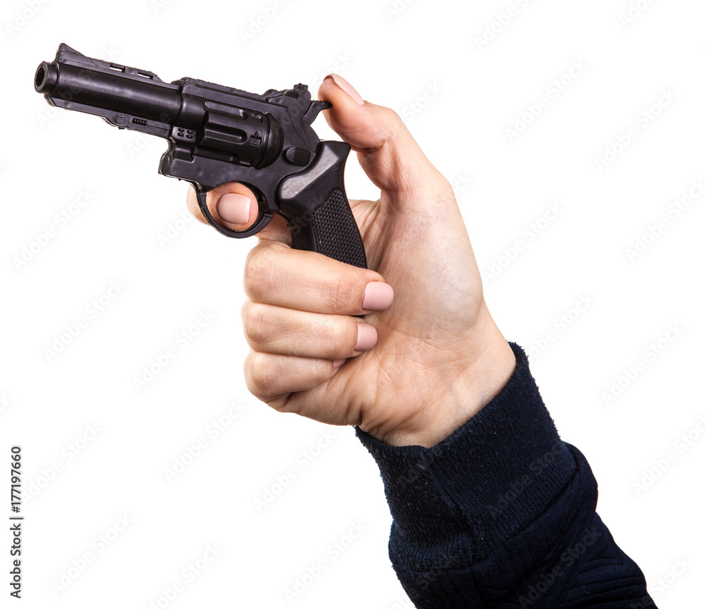 female hand with a toy gun. Isolated on white background female hand with a toy gun. Isolated on white background