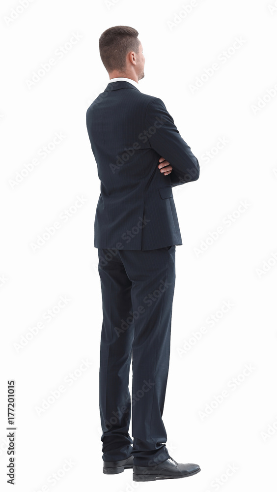 rear view.confident businessman with briefcase