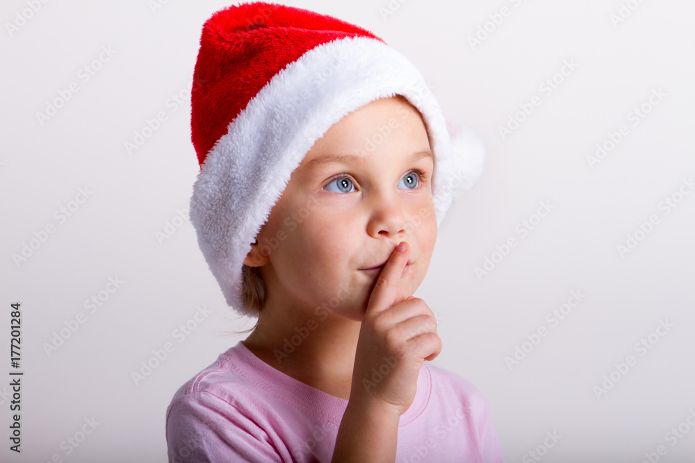 Cute little girl in the santa claus hat Cute little girl in the santa claus hat