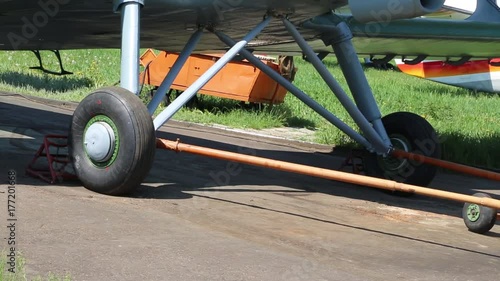 A small plane gets into the parking lot. photo