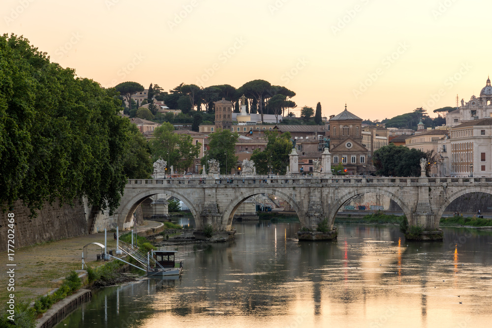 ROME, ITALY - JUNE 22, 2017: Amazing Sunset view of St. Angelo Bridge and tiber River in city of Rome, Italy