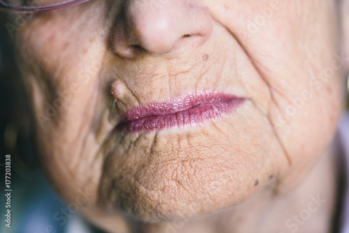 Close up of the mouth of elderly lady photo