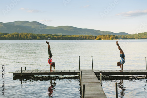 Children on Playing on Dock at Sunset